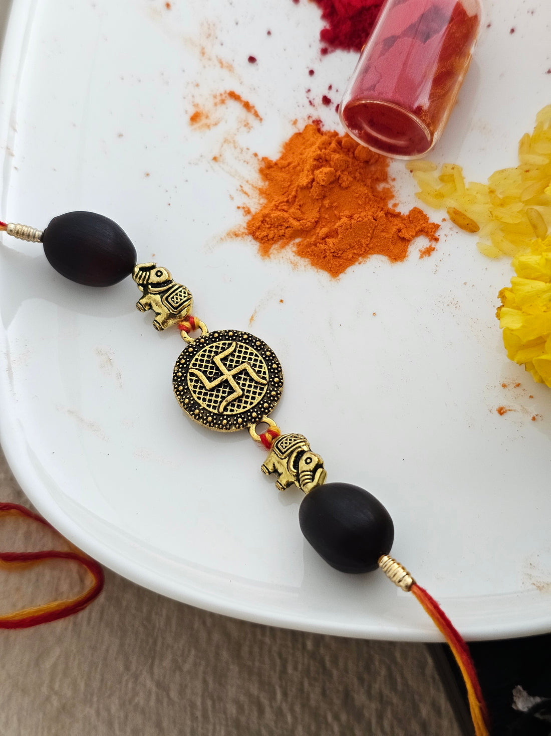 Golden Swastik Charm Rakhi