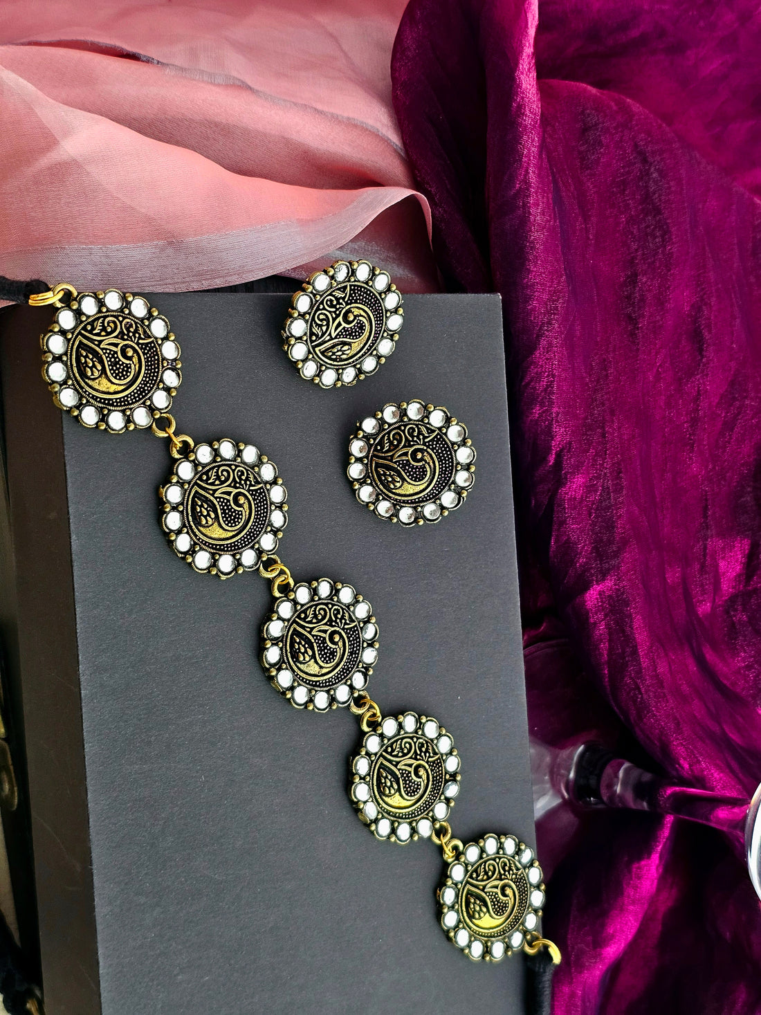 Golden choker necklace set with matching earrings