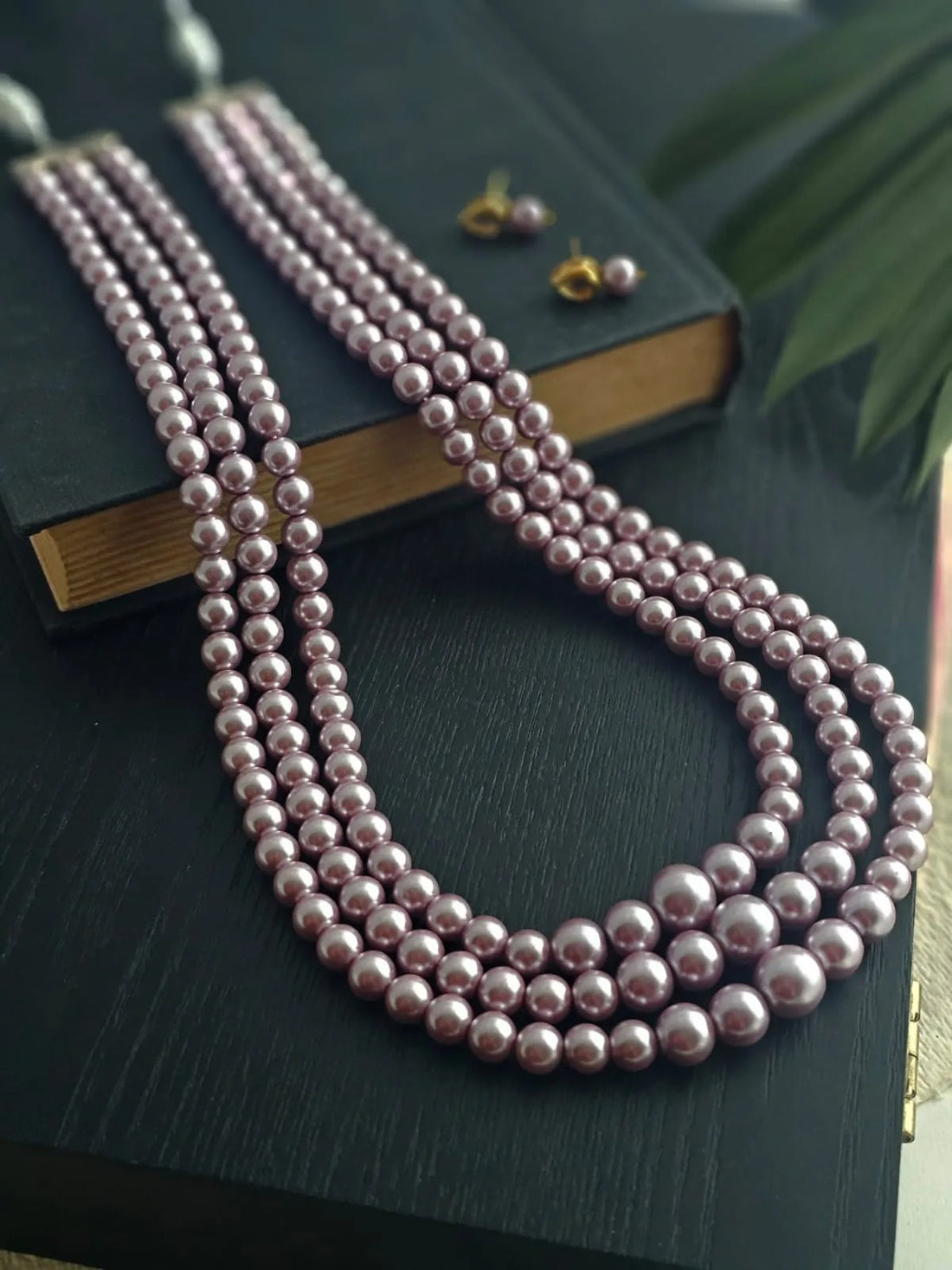 Elara Lavender Three-Stranded Pearl Necklace Set.