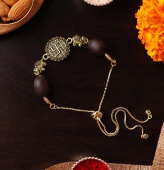 Golden Swastik Charm Rakhi